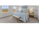 This is a main bedroom featuring neutral carpet, light fixture, windows and bed at 1005 Toland Dr # 44P, Saint George, SC 29477