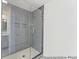 Modern bathroom shower featuring glass door and gray tile at 1005 Toland Dr # 44P, Saint George, SC 29477