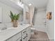 Well-lit bathroom with double vanity, neutral color scheme, and combined shower and tub at 1007 Toland Dr # 45P, Saint George, SC 29477