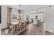 Dining room with wood dining table, chairs, and views into the kitchen at 1007 Toland Dr # 45P, Saint George, SC 29477