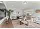 Bright living room with modern decor, stylish rug, and open access to the kitchen at 1007 Toland Dr # 45P, Saint George, SC 29477