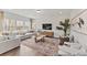 Spacious living room featuring a large sectional sofa and expansive windows with natural light at 1007 Toland Dr # 45P, Saint George, SC 29477