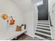 Hallway with bench, coat hooks, and adjacent stairs showcasing modern design and functionality at 1007 Toland Dr # 45P, Saint George, SC 29477