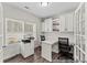 Bright office with large windows, modern desk, cabinets, and ample storage space at 1007 Toland Dr # 45P, Saint George, SC 29477