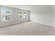 Bright bedroom with two windows and neutral carpeting, ready for personal touches at 1009 Toland Dr # 46P, Saint George, SC 29477