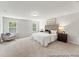 Spacious main bedroom with plush carpeting, soft natural light, and a decorative accent chair at 1009 Toland Dr # 46P, Saint George, SC 29477