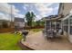 Outdoor patio with dining set, grill, and lush landscaping, perfect for entertaining guests and enjoying outdoor meals at 106 Gathering Island Rd, Summerville, SC 29485
