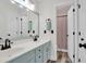 Stylish bathroom featuring a double vanity with sleek faucets, and a doorway view to a shower at 106 Gathering Island Rd, Summerville, SC 29485