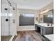 This bathroom boasts a walk in shower, wood-look floors, and a vanity with stylish fixtures at 106 Gathering Island Rd, Summerville, SC 29485
