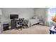 Cozy bedroom with a twin bed, computer desk, and wood-look floors at 106 Gathering Island Rd, Summerville, SC 29485