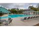 Inviting community pool area with lounge chairs and a shaded pavilion for relaxing and enjoying the sun at 106 Gathering Island Rd, Summerville, SC 29485