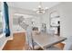 Open dining room with hardwood floors, modern lighting and stairway views at 106 Gathering Island Rd, Summerville, SC 29485