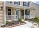 Charming front porch with decorative columns and landscaping, perfect for relaxing at 106 Gathering Island Rd, Summerville, SC 29485