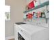 This laundry room has shelving stocked with detergent and cleaning supplies at 106 Gathering Island Rd, Summerville, SC 29485