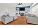 Bright living room features a fireplace, built-in shelves, and large windows at 106 Gathering Island Rd, Summerville, SC 29485