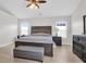Spacious main bedroom with lots of natural light, ceiling fan, and modern furniture at 106 Gathering Island Rd, Summerville, SC 29485