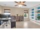 This office space has a bookshelf, wood-look floors, and a ceiling fan at 106 Gathering Island Rd, Summerville, SC 29485
