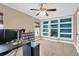 Office space with built-in bookshelves, a ceiling fan, and wood-look floors at 106 Gathering Island Rd, Summerville, SC 29485