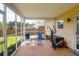 This screened patio area includes outdoor seating and exercise equipment at 106 Gathering Island Rd, Summerville, SC 29485