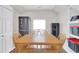 This storage area has a wood table, chairs, and black and red storage bins at 106 Gathering Island Rd, Summerville, SC 29485