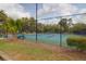 Well-maintained tennis courts surrounded by lush greenery, perfect for enjoying outdoor recreation at 106 Gathering Island Rd, Summerville, SC 29485