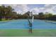 Aerial view of the community tennis courts with lush landscaping, offering a great recreational amenity at 106 Gathering Island Rd, Summerville, SC 29485