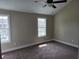 Bedroom with neutral walls, plush carpeting, and two windows at 108 Sandlewood Dr, Summerville, SC 29483