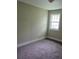 Bedroom with neutral walls, plush carpeting, and a bright window at 108 Sandlewood Dr, Summerville, SC 29483