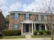 Charming brick townhouse with a covered front porch and manicured landscaping at 108 Sandlewood Dr, Summerville, SC 29483