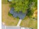An aerial shot shows a home with a well-maintained lawn, driveway, and backyard at 1111 Kilarney Rd, Mount Pleasant, SC 29464