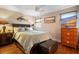 Comfortable bedroom showcases a ceiling fan, TV, and a serene ambiance, perfect for relaxing at 1111 Kilarney Rd, Mount Pleasant, SC 29464