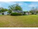 Well-maintained home with a green lawn and colorful bushes along the front, in a residential neighborhood at 1111 Kilarney Rd, Mount Pleasant, SC 29464