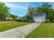 Traditional ranch-style home with well-kept lawn and a driveway leading to an attached garage at 1111 Kilarney Rd, Mount Pleasant, SC 29464