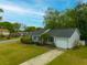A charming single-story home with an attached garage, lush green lawn, and landscaped yard at 1111 Kilarney Rd, Mount Pleasant, SC 29464