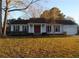 Charming single-story home featuring a well-maintained lawn and attached garage at 1111 Kilarney Rd, Mount Pleasant, SC 29464