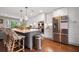 A modern kitchen boasts stainless steel appliances, white cabinets, and a gray island at 1111 Kilarney Rd, Mount Pleasant, SC 29464