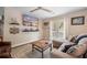 Comfortable living room featuring a large screen TV and doors leading to a patio at 1111 Kilarney Rd, Mount Pleasant, SC 29464