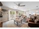 Cozy living room with doors to the outside, a ceiling fan and open floor plan at 1111 Kilarney Rd, Mount Pleasant, SC 29464