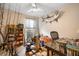 Office/Spare bedroom has a desk, fishing rods, and natural light, perfect for working or enjoying hobbies at 1111 Kilarney Rd, Mount Pleasant, SC 29464
