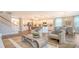 Open-concept living area shows kitchen, dining and stairs at 112 Coastline St, Ridgeville, SC 29472