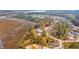 Gorgeous aerial view showing a home situated among trees and waterways in a serene, beautiful community at 116 Peninsula Dr, Ravenel, SC 29470