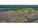 Beautiful aerial view of coastal wetlands and wooded area with new home construction at 116 Peninsula Dr, Ravenel, SC 29470