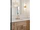 Bathroom vanity featuring granite counters, modern fixtures, and wood cabinets at 116 Peninsula Dr, Ravenel, SC 29470