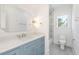Stylish bathroom featuring vanity with elegant mirror, natural light and glass enclosed shower at 116 Peninsula Dr, Ravenel, SC 29470