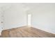 Spacious bedroom with hardwood floors, white walls, ceiling fan and ample natural light at 116 Peninsula Dr, Ravenel, SC 29470
