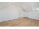 Bright bedroom with a ceiling fan, wooden floors, and a doorway into an adjacent room at 116 Peninsula Dr, Ravenel, SC 29470