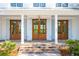 Elegant entrance with brick steps and wooden doors at 116 Peninsula Dr, Ravenel, SC 29470