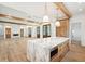 Open-concept kitchen with island, marble countertops, natural lighting, and hardwood floors at 116 Peninsula Dr, Ravenel, SC 29470