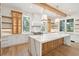 Stunning kitchen with large island, marble countertops, premium appliances, and stylish lighting at 116 Peninsula Dr, Ravenel, SC 29470
