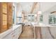 Bright and airy kitchen with marble island, modern cabinets, and natural wood accents at 116 Peninsula Dr, Ravenel, SC 29470